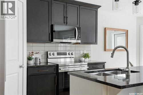 662 Sutter Bay, Saskatoon, SK - Indoor Photo Showing Kitchen With Double Sink