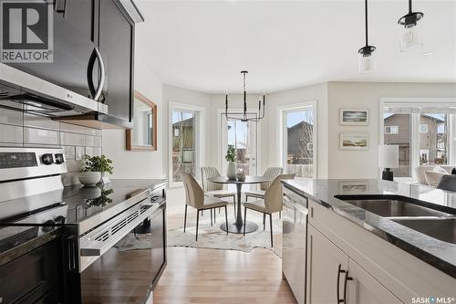 662 Sutter Bay, Saskatoon, SK - Indoor Photo Showing Kitchen With Double Sink With Upgraded Kitchen