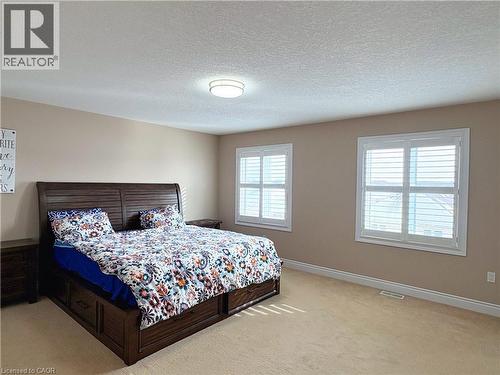 Bedroom with light colored carpet and a textured ceiling - 34 Watervale Drive Unit# Upper, Kitchener, ON - Indoor Photo Showing Bedroom