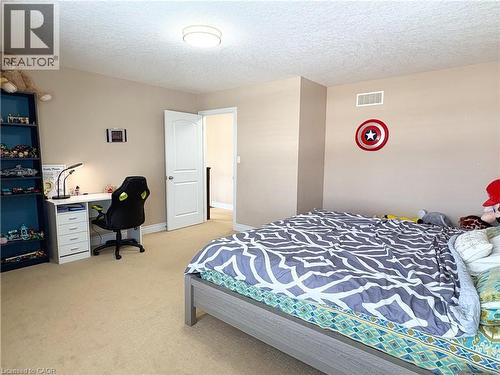 Bedroom with light carpet and a textured ceiling - 34 Watervale Drive Unit# Upper, Kitchener, ON - Indoor Photo Showing Bedroom