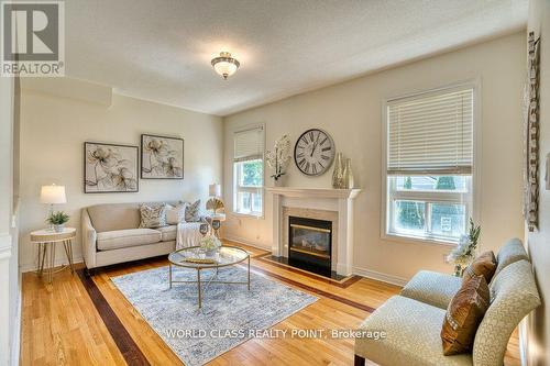 3 Hesham Drive, Whitby, ON - Indoor Photo Showing Living Room With Fireplace