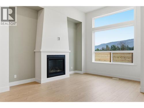 2468 Bradley Drive, Armstrong, BC - Indoor Photo Showing Living Room With Fireplace
