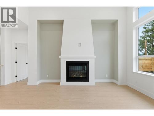 2468 Bradley Drive, Armstrong, BC - Indoor Photo Showing Living Room With Fireplace