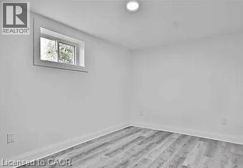 Bedroom 1 with light wood finished floors - 549 Waterloo Street, Hamilton, ON - Indoor Photo Showing Other Room