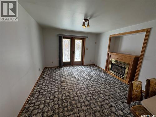 505 March Avenue E, Langenburg, SK - Indoor Photo Showing Other Room With Fireplace