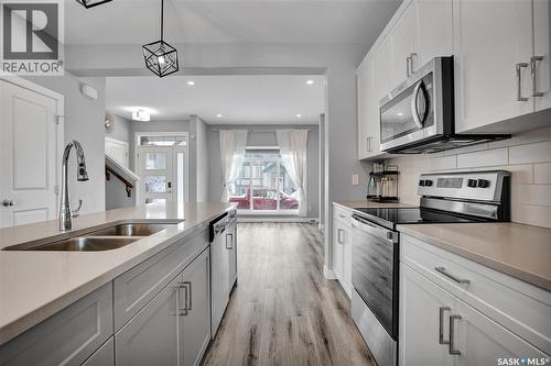 959 Mcfaull Manor, Saskatoon, SK - Indoor Photo Showing Kitchen With Double Sink With Upgraded Kitchen