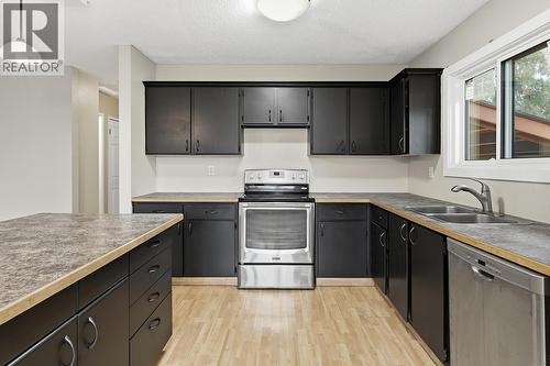 5187 Chute Lake Crescent, Kelowna, BC - Indoor Photo Showing Kitchen With Double Sink