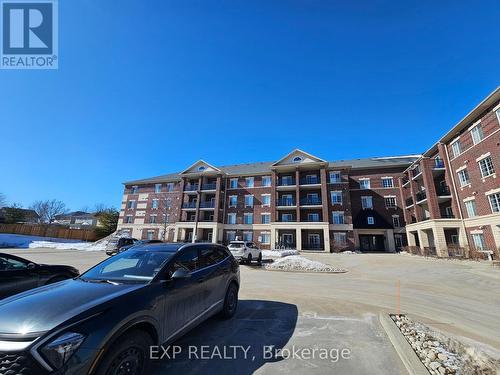 102 - 308 Watson Parkway N, Guelph, ON - Outdoor With Balcony With Facade