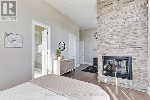1 Windrose Valley Boulevard, Clearview, ON - Indoor Photo Showing Bedroom With Fireplace