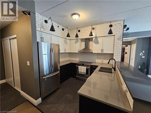 308 Watson Parkway N Unit# 102, Guelph, ON - Indoor Photo Showing Kitchen With Stainless Steel Kitchen With Double Sink