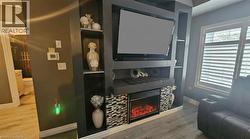 Entertainment area with b/i electric fireplace - 