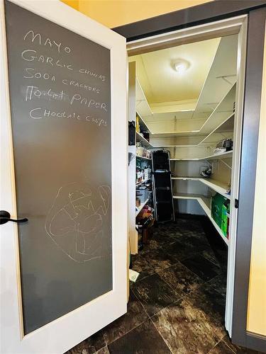 Large walk in pantry great for storing brooms and larger kitchen gadgets etc. - Pierson, Manitoba 