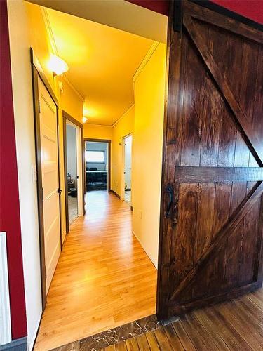 Walkway to two bedrooms, a 4 piece bathroom with beautiful walk in shower - Pierson, Manitoba 