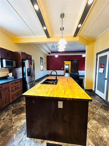 Kitchen island with room for seating, a plug in, space for the dishwasher  & sink in place. - Pierson, Manitoba 