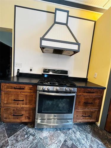 Propane stove with hood vent. - Pierson, Manitoba 