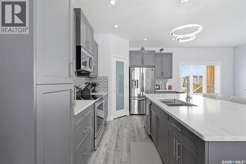 406 Hamm Lane, Saskatoon, SK - Indoor Photo Showing Kitchen With Double Sink With Upgraded Kitchen