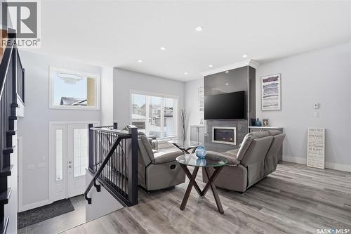 406 Hamm Lane, Saskatoon, SK - Indoor Photo Showing Other Room With Fireplace