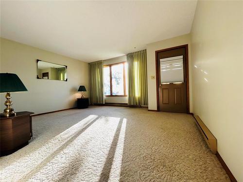 Main level living room - one of 3 living areas this home has to offer. - 244 Centennial Crescent, Melita, MB - Indoor Photo Showing Other Room