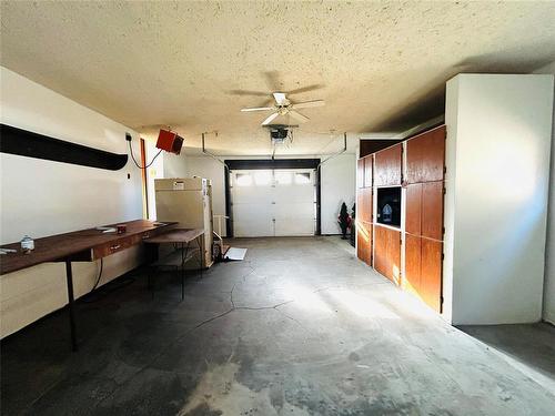 View of the inside of the heated oversized garage with wheelchair ramp included in the sale. - 244 Centennial Crescent, Melita, MB - Indoor Photo Showing Garage