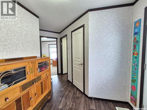 151 2Nd Avenue, Bengough, SK - Indoor Photo Showing Other Room With Fireplace