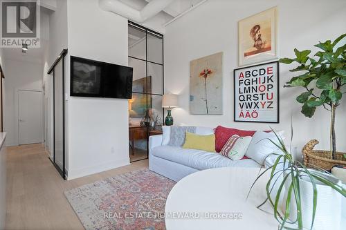 Wall Mounted TV for relaxing - 207 - 150 Logan Avenue, Toronto, ON - Indoor Photo Showing Living Room