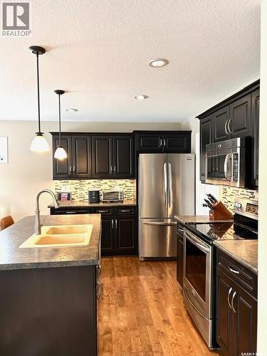 5245 Canuck Crescent, Regina, SK - Indoor Photo Showing Kitchen With Stainless Steel Kitchen With Double Sink With Upgraded Kitchen
