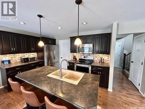 5245 Canuck Crescent, Regina, SK - Indoor Photo Showing Kitchen With Stainless Steel Kitchen With Double Sink With Upgraded Kitchen