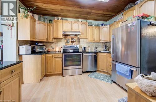 stainless steel appliances, quartz breakfast counter - 12 Leinster Avenue S, Hamilton, ON - Indoor Photo Showing Kitchen