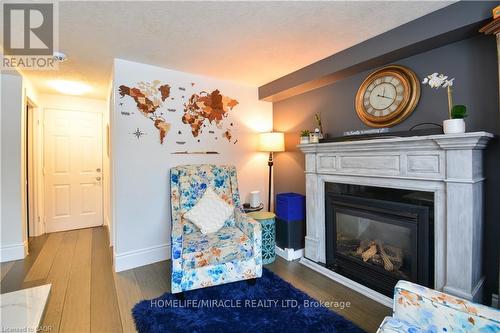 39 Endeavour Drive, Cambridge, ON - Indoor Photo Showing Living Room With Fireplace
