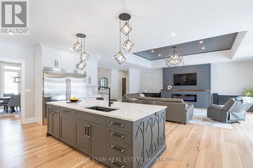 7 Reynolds Road, Tiny, ON - Indoor Photo Showing Kitchen With Fireplace With Double Sink With Upgraded Kitchen