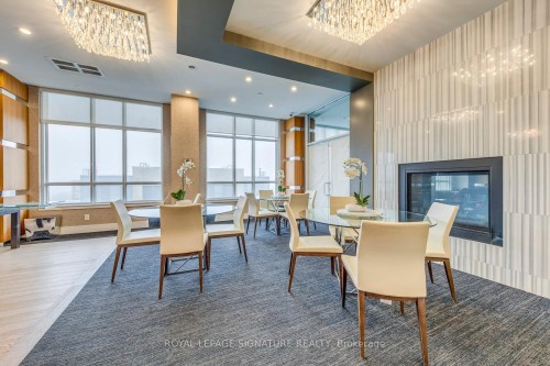 1411-9201 Yonge Street, Richmond Hill, ON - Indoor Photo Showing Dining Room With Fireplace