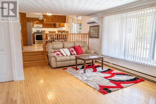Family room with bay window overlooking backyard - 577 Lynwood Drive, Cornwall, ON - Indoor Photo Showing Living Room