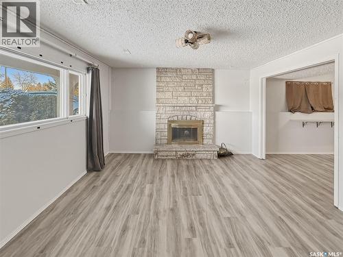 264 Hayes Drive, Swift Current, SK - Indoor Photo Showing Living Room With Fireplace