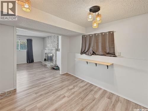 264 Hayes Drive, Swift Current, SK - Indoor Photo Showing Other Room With Fireplace
