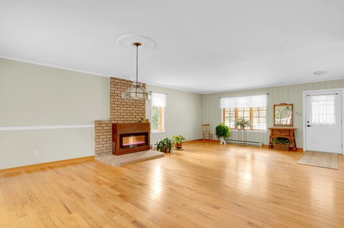 Living Room - 1528 Mtée Sauvage, Prévost, QC - Indoor Photo Showing Living Room With Fireplace