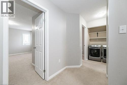 second floor landing with convenient laundry. - 39 Brookfield Crescent, Kitchener, ON - Indoor Photo Showing Laundry Room