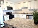24 Morrison Road Unit# A13, Kitchener, ON  - Indoor Photo Showing Kitchen With Upgraded Kitchen 