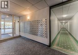 View of home's community with a drop ceiling and mail area - 