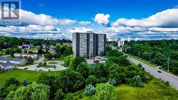 View of urban area featuring a tree filled landscape - 