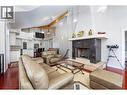 Brazilian cherry hardwood flooring - 375 Trumpeter Court, Kelowna, BC  - Indoor Photo Showing Living Room With Fireplace 