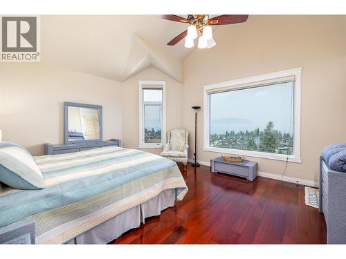Master bedroom on the main floor - 375 Trumpeter Court, Kelowna, BC - Indoor Photo Showing Bedroom