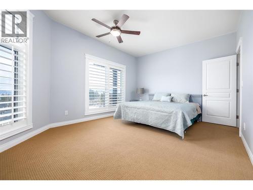 Another bedroom with view - 375 Trumpeter Court, Kelowna, BC - Indoor Photo Showing Bedroom