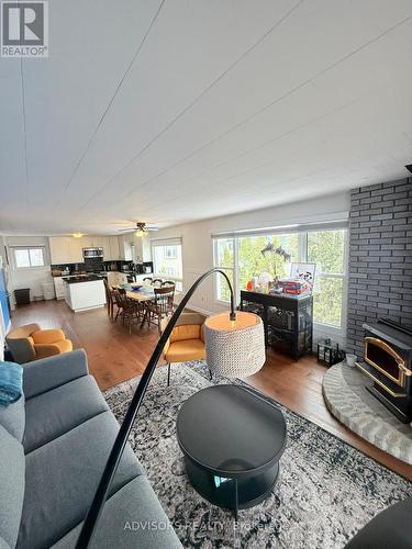 9 Bow Road, Tiny, ON - Indoor Photo Showing Living Room With Fireplace