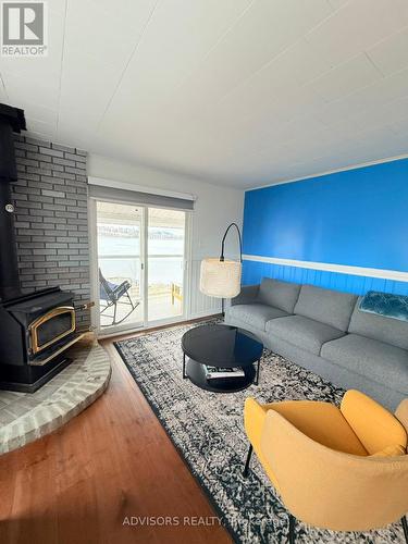9 Bow Road, Tiny, ON - Indoor Photo Showing Living Room With Fireplace