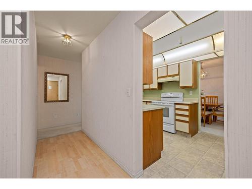 Kitchen off to the right - 1045 Sutherland Avenue Unit# 306, Kelowna, BC - Indoor Photo Showing Kitchen