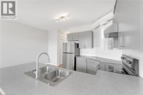 657 Barton Street E Unit# 302, Hamilton, ON - Indoor Photo Showing Kitchen With Double Sink