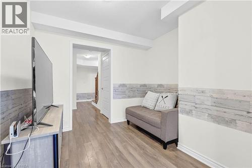 Sitting room with light wood-type flooring and a wainscoted wall - 143 Ridge Road Unit# 48, Cambridge, ON - Indoor