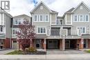 Traditional-style home featuring a balcony, driveway, brick siding, and a garage - 143 Ridge Road Unit# 48, Cambridge, ON  - Outdoor With Balcony With Facade 