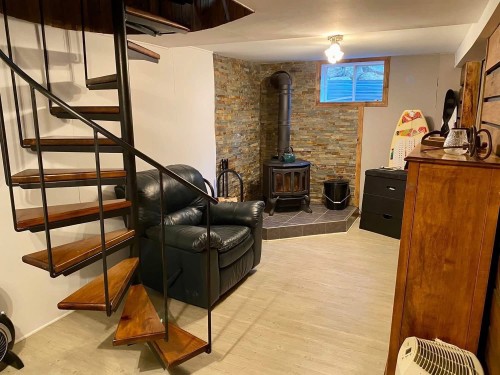 Salle familiale - 2458 Ch. Des Aubépines, La Conception, QC - Indoor Photo Showing Other Room With Fireplace