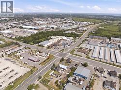 Aerial perspective showcasing an expansive commercial and industrial district - 